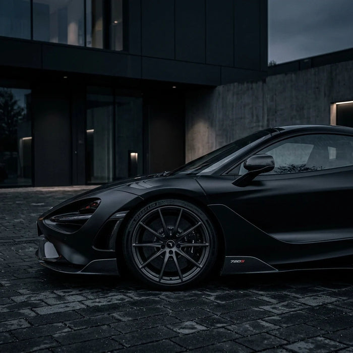 Black sports car in deep shadow edited with the BLVCK Legends preset — crushed blacks, desaturated colour